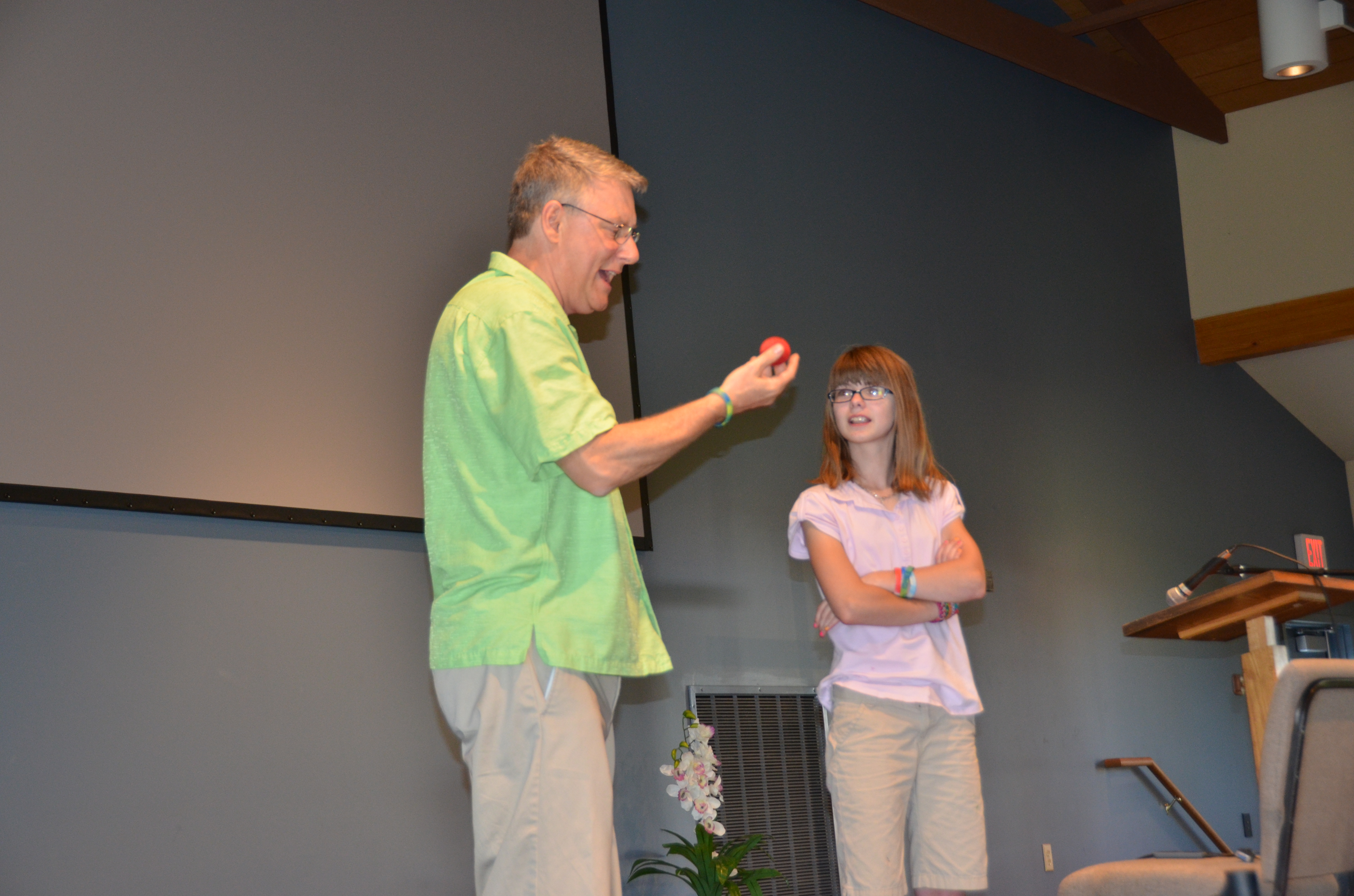 Tampa Bay area children’s magician for hire Timothy Pitch holding a red ball