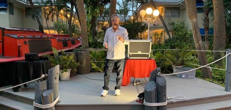 Tampa Bay area corporate event entertainer Timothy Pitchstanding on stage